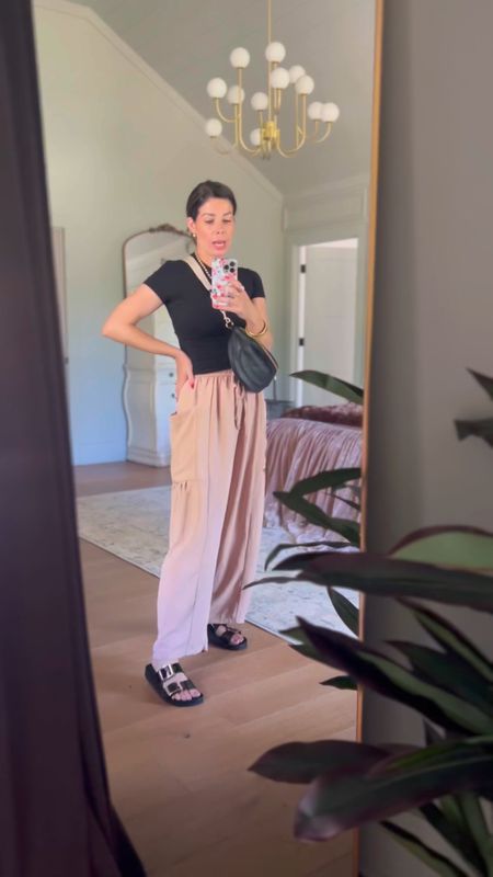 Love these viral wide leg flowy pants! Skims inspired tee is so good I got it in 4 colors. I grab these Birkenstock inspired sandals all the time! Oh and this black belt bag is def a new favorite!

#LTKVideo #LTKTravel #LTKOver40