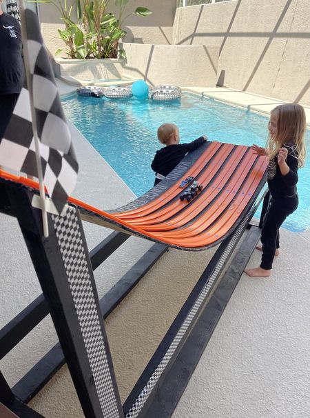 DIY Monster truck & race car track using hot wheels tracks! Vann is obsessed! It was easy to make too. 10/10 would recommend trying if you have a kids whose into it! Journey even loves it 😅

Materials:
Plywood: 2 pieces
2x4x10 wood: 3 pieces
Glue gun
3 packs of hot wheels tracks (see link)
Black & gray spray paint
Checkered tape
Checkered flags 

Monster truck party | diy race track | DIY toys | DIY kids gifts | DIY monster truck track | hot wheels tracks | hot wheels party | monster jam party | toddler boy party themes | monster truck theme | grave digger gift | monster truck gift idea | toddler gift ideas | toddler boy gift idea | boys gift ideas | boy gift guide | toddler boy gift guide | DIY toddler gifts

#LTKkids #LTKGiftGuide #LTKparties