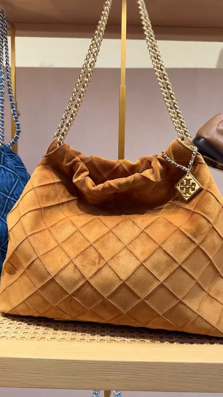 The Fleming Soft Drawstring Bag from Tory Burch features a soft, quilted leather design, a drawstring closure, and a detachable shoulder strap, making it a chic and versatile accessory for various occasions.
this bag may be an ideal gift for her!

#personalshopper #shopping #toryburch #bag #suede #denim #ltk #mall #florida #usa #ootd #styleinspiration

#LTKStyleTip #LTKGiftGuide #LTKHoliday