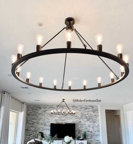 Obsessed with these wagon wheel chandeliers in our greatroom 

#LTKhome