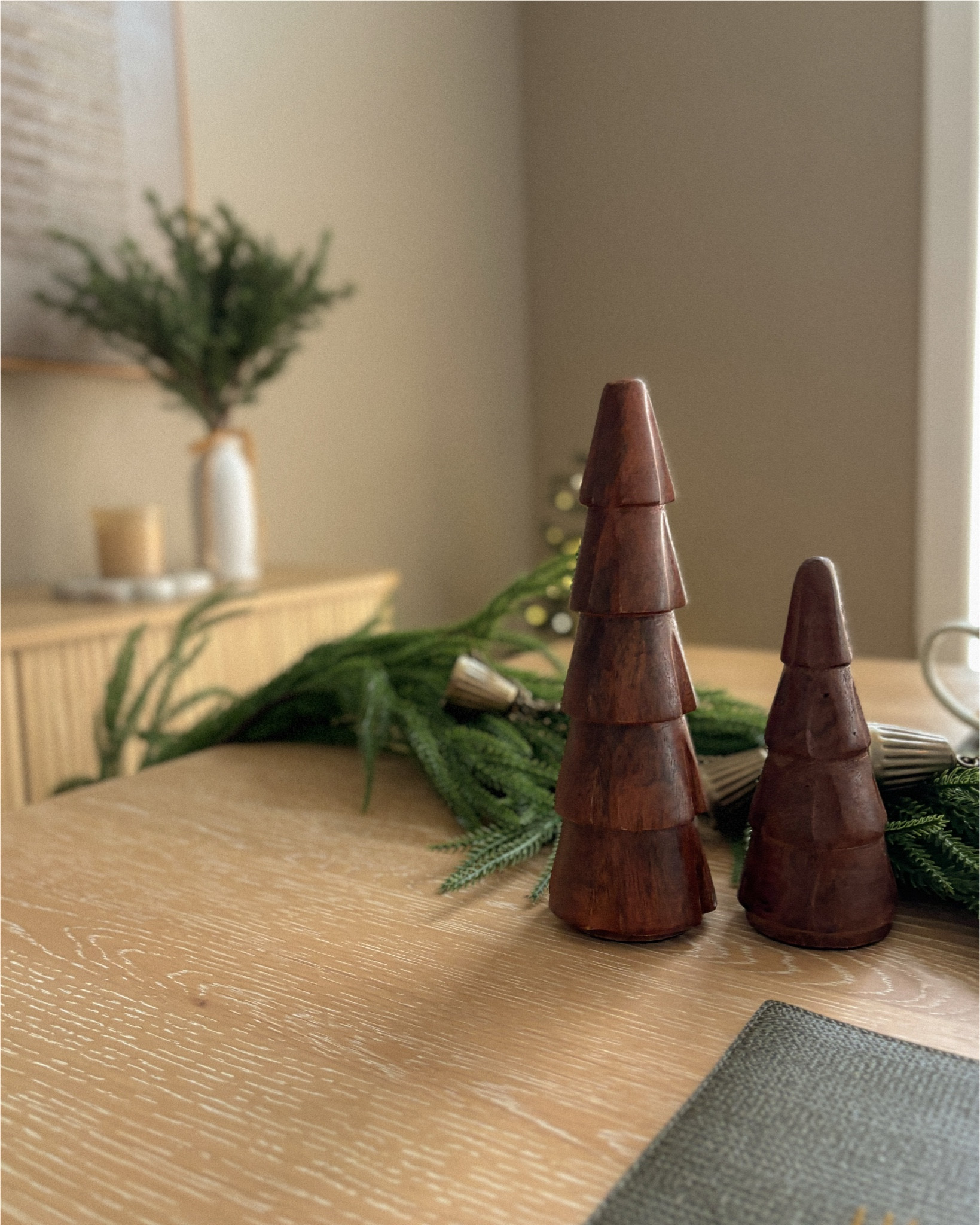 Wooden Christmas trees and a sweet bell garland — simple details, perfect holiday charm.

#WoodenDecor #BellGarland #RusticChristmas #HolidayTablescape #FestiveVibes #CozyDecor

#LTKSeasonal #LTKHoliday #LTKHome