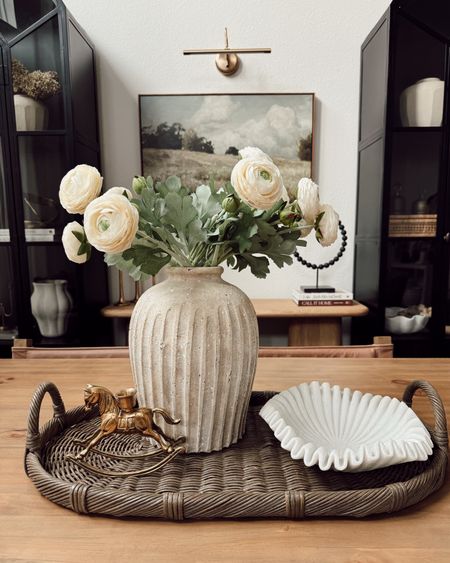 simple tray idea ✨

for a dining table centerpiece ☺️

+ oval woven tray
+ vase
+ faux florals from Amazon
+ ruffle bowl
+ cute horse candle holder 

what do you think of this setup? I love the look of the candle holder on its own as a decorative object but also excited to see it with a candle! I got that gem on Etsy 🫶🏼 everything will be linked in my bio and on my LTK page 



#LTKhome #LTKfindsunder100 #LTKfindsunder50
