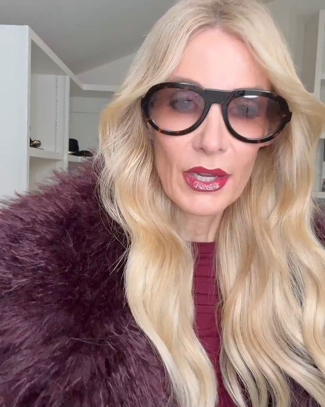 Burgundy is having such a moment, and this outfit is proof 🫦 This top is unbelievably soft — like second-skin soft — and I’m obsessed with the thumb holes and subtle gathering. It’s super flattering and incredibly slimming, plus this rich burgundy shade is just gorgeous on. I paired it with my new favorite Mother Jeans — a high-waisted baby flare that is so slimming and makes your legs look miles long. Truly one of those jeans you reach for again and again. Then I topped everything off with this fabulous burgundy faux fur because… why not? And this suede burgundy handbag is chef’s kiss — beautiful gold detailing, so classy and elegant, and it comes in five different colors. Everything runs true to size. I’m wearing an XS in the top and jacket and a 24 in the denim. Would you wear this rich burgundy head-to-toe look? 🍷✨ #Over40Style #ChicAtAnyAge #BurgundyStyle #FallFashion #ElevatedBasics #DenimStyle #EffortlessChic 

 

#LTKHoliday #LTKgrwm #LTKOver40