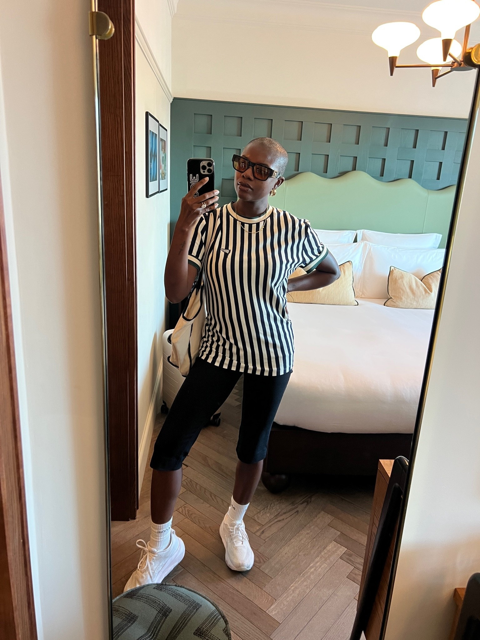 Travel day outfit! Striped shirt with black Capri pants and white sneakers!