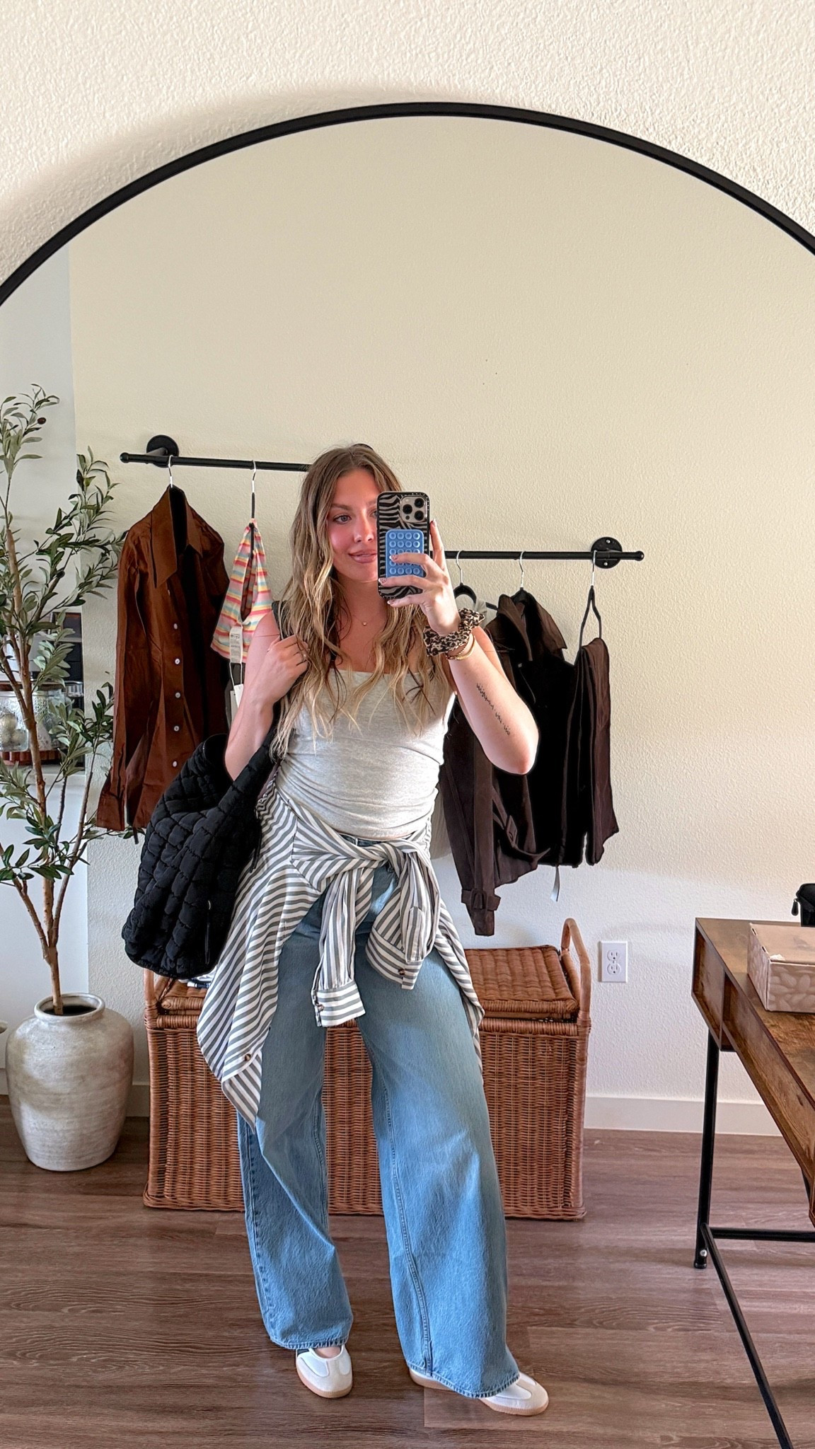 In 510 wearing a 27 extra tall in jeans and medium in top!