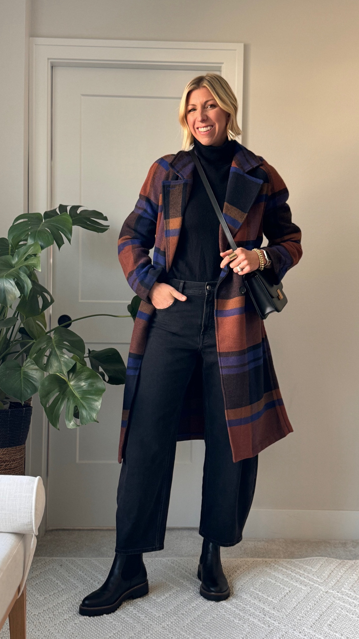 Chic winter outfit idea: monochrome black look: barrel jeans, cashmere sweater, Chelsea boots + plaid jacket 

#LTKCyberWeek #LTKHoliday #LTKGiftGuide