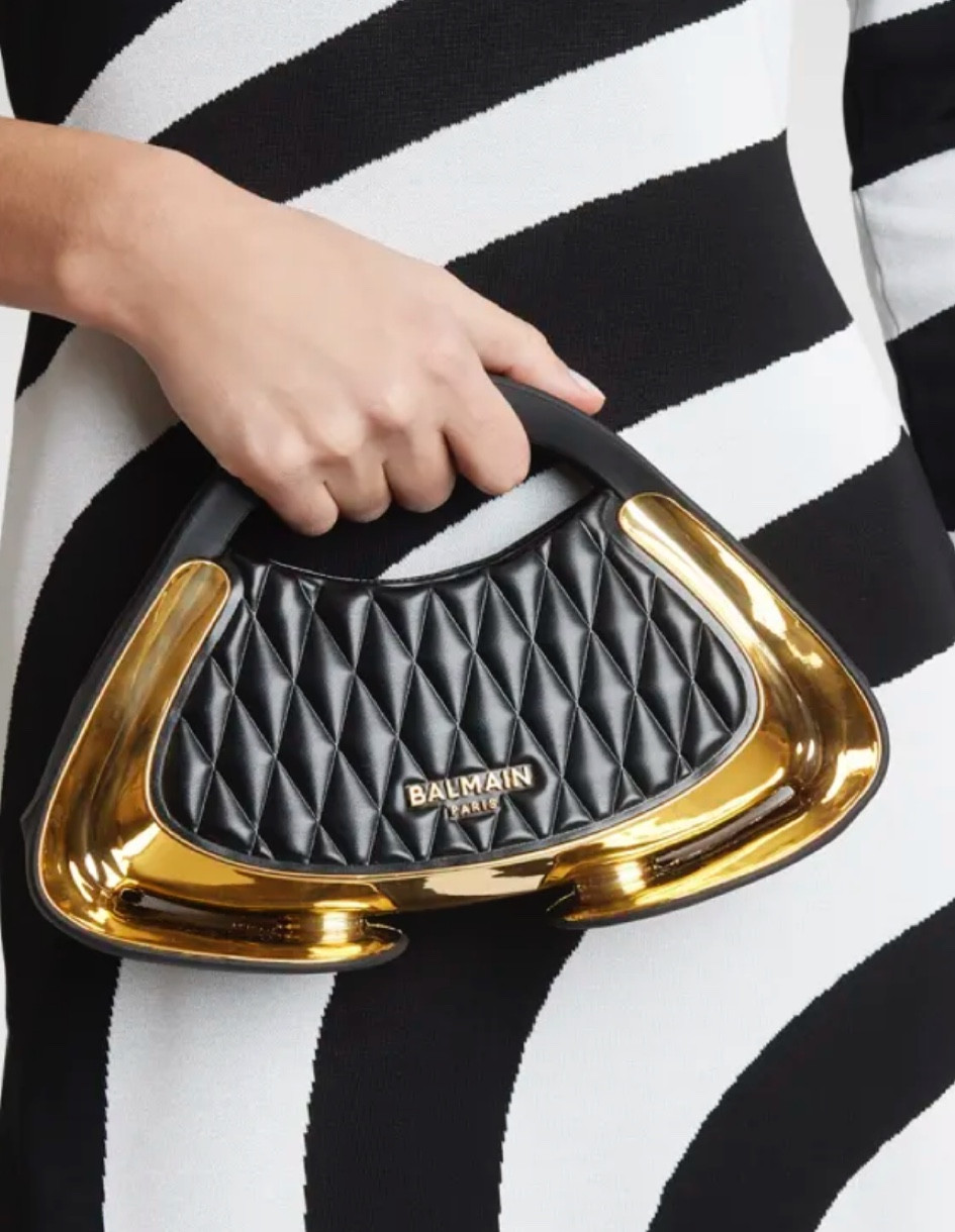 Balmain
Jolie Madam Small Top-Handle Bag in Quilted Faux Leather

Rendered in a quilted construction, Balmain's Jolie Madame bag features glossy curved sides and goldtone logo hardware

#LTKStyleTip #LTKItBag #LTKParties