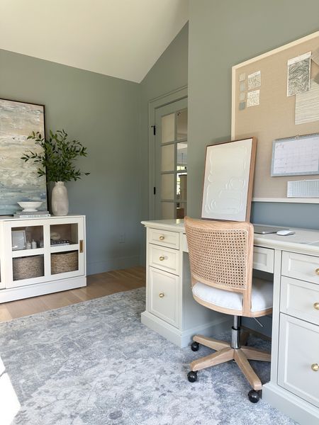 Home office, cane office chair, off white executive desk with file storage, brass ball cabinet knobs from Amazon, large linen pin board, office storage, large coastal art from Lindsay Letters Co 

#LTKfamily #LTKhome #LTKstyletip