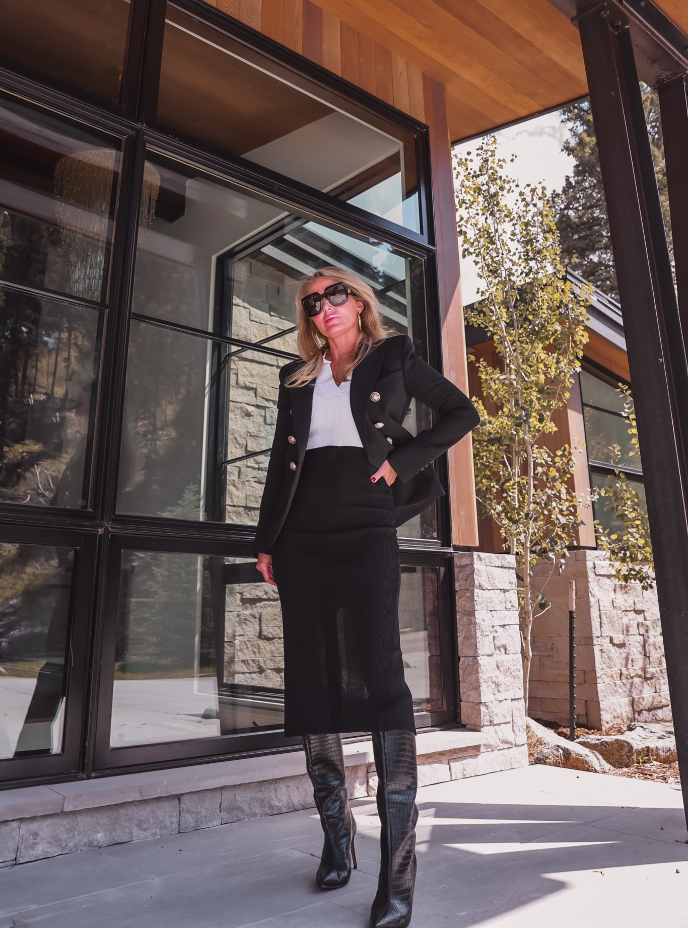 This Remain Birger Christensen color-blocked midi dress is like the holy grail of dresses. It’s one you will want to wear ALL. THE. TIME. The dress is incredibly flattering with its strategic color-blocking and universally flattering v-neckline. The white portion of the dress starts just above the natural waist, so it creates the look of a shorter torso and tinier waist. While in contrast, the black section minimizes the tummy, hips, butt, and thighs and creates the illusion of longer legs.

It's also super lightweight so you’ll stay cool even in warmer climates (or during hot flashes) and thin enough to layer beautifully under jackets and blazers. I even wore it with my Balmain blazer, which fits very tight to the body, with NO issue. Wear it everywhere from events to dinner to coffee or the office this fall with just a few simple accessory changes. (Fit is true to size.)

I styled this dress with an amazing pair of black croc-embossed Schutz boots (TTS), Dean Davidson hoop earrings, and glam Gucci sunglasses for a super chic, fall-ready look.

~Erin xo

#LTKSeasonal #LTKworkwear #LTKstyletip