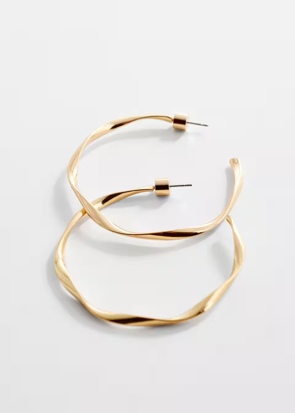 Twisted hoop earrings -  Women | Mango United Kingdom | MANGO (UK)