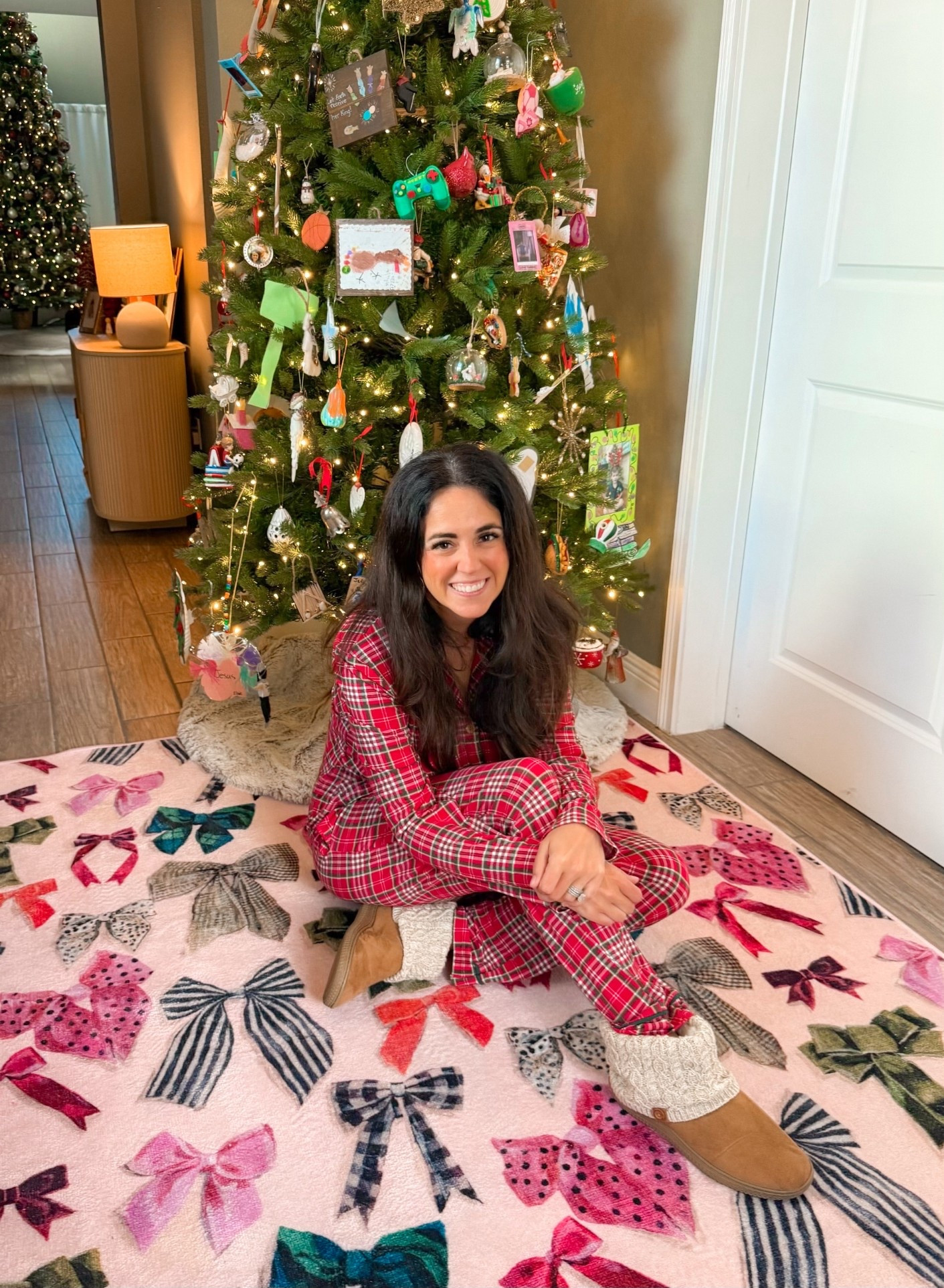 We decorated the family tree today in our Sweethoney pajamas (not linkable but check them out). This King of Christmas tree is 25% off and definitely worth the splurge. The quality is amazing, even converted me from Balsam Hill. 

The Ruggable bow rug is a new favorite for our entry this season, so playful and fun and on 30% off sale for Black Friday. It’s perfect for all the pink Christmas loving girlies. 

My cozy slippers are from Walmart and are a great look for less. 
 
Christmas decor 
#ltkmomlife #ltkseasonal 

#LTKSaleAlert #LTKHome #LTKHoliday
