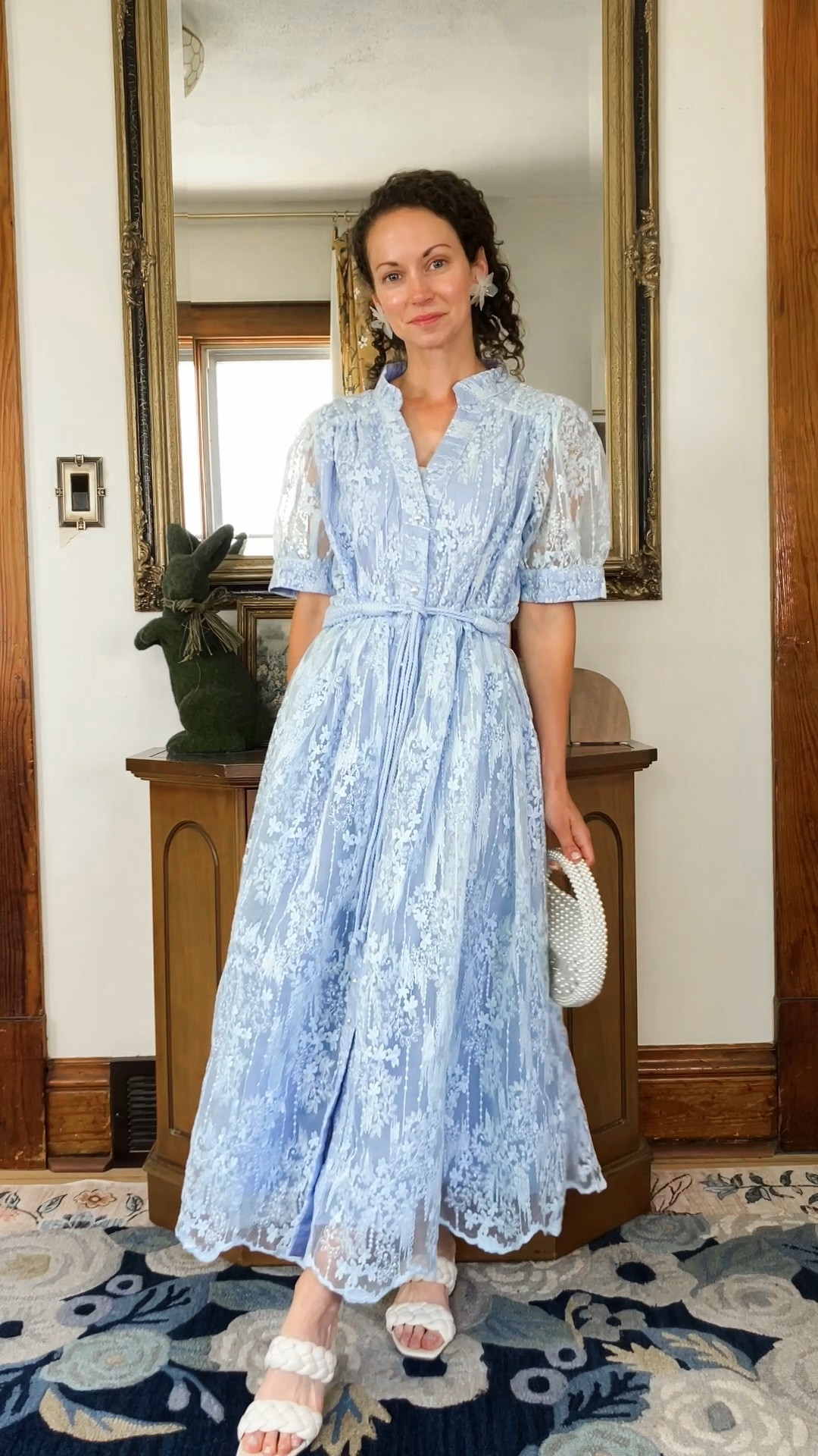 A beautiful blue lace dress!
Blue lace dress from Chicwish. 
White woven sandals are old, linking similar. 
Large flower earrings from Amazon. 
White pearl bag from Chicwish. 
Floral satin robe from Amazon  
Petite outfit. Wedding guest dress. Summer dress. Modest dress. 

#LTKOver40 #LTKWedding #LTKootd