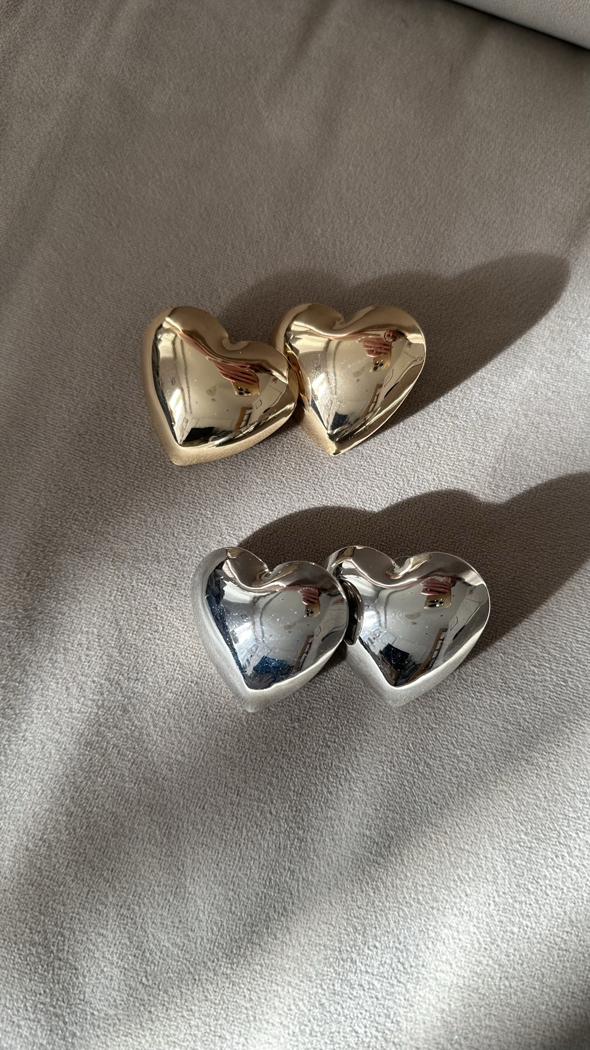 Heart to heart: gold and silver puffy statement earrings doing all the talking today 💖✨
.
puffy heart earrings | statement earrings | gold earrings | silver earrings | everyday jewellery | layered earrings | bold earrings | jewellery flatlay | jewellery edit | gift guide jewellery | festive jewellery | playful jewellery | elevated basics 

#LTKluxury #LTKdatenight #LTKgiftguide