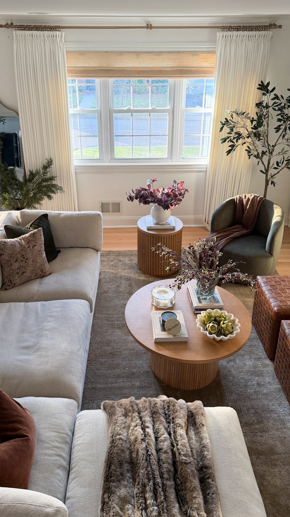 Somehow this room becomes the heart of our home every holiday season 🤎
It’s where the kids pile onto the sofa with blankets, where we sip coffee before the day gets loud, and where we end the night with Christmas movies and snacks we probably don’t need. 😍🙈

I wanted it to feel calm and layered, not overloaded — soft textures, warm wood tones, winter stems, and just enough seasonal touches to make it feel special without changing everything.

#LTKHoliday #LTKSaleAlert #LTKHome