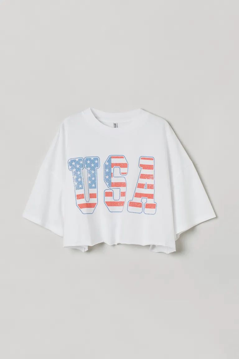 Boxy crop top in soft cotton jersey with a printed design. Ribbed crew neck, heavily dropped shou... | H&M (US)
