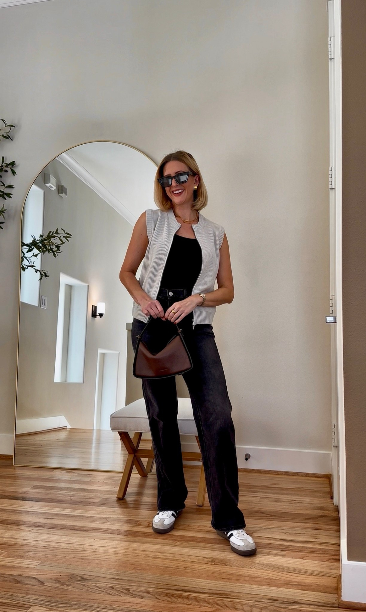 Casual fall outfit that feels effortlessly polished 🍂 I paired a knit zip vest with a black tank, straight-leg jeans, and retro sneakers for a comfy yet elevated everyday look. Perfect for errands, travel, or weekend coffee runs.

#LTKStyleTip #LTKFindsUnder100 #LTKFindsUnder50