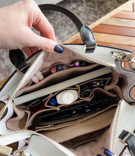 How I organize my Kate Spade bag using a felt insert and what I store inside it. There’s always an Erin Condren notebook and pens, and also a multi-tool just in case. 😁

#LTKtravel #LTKstyletip #LTKitbag