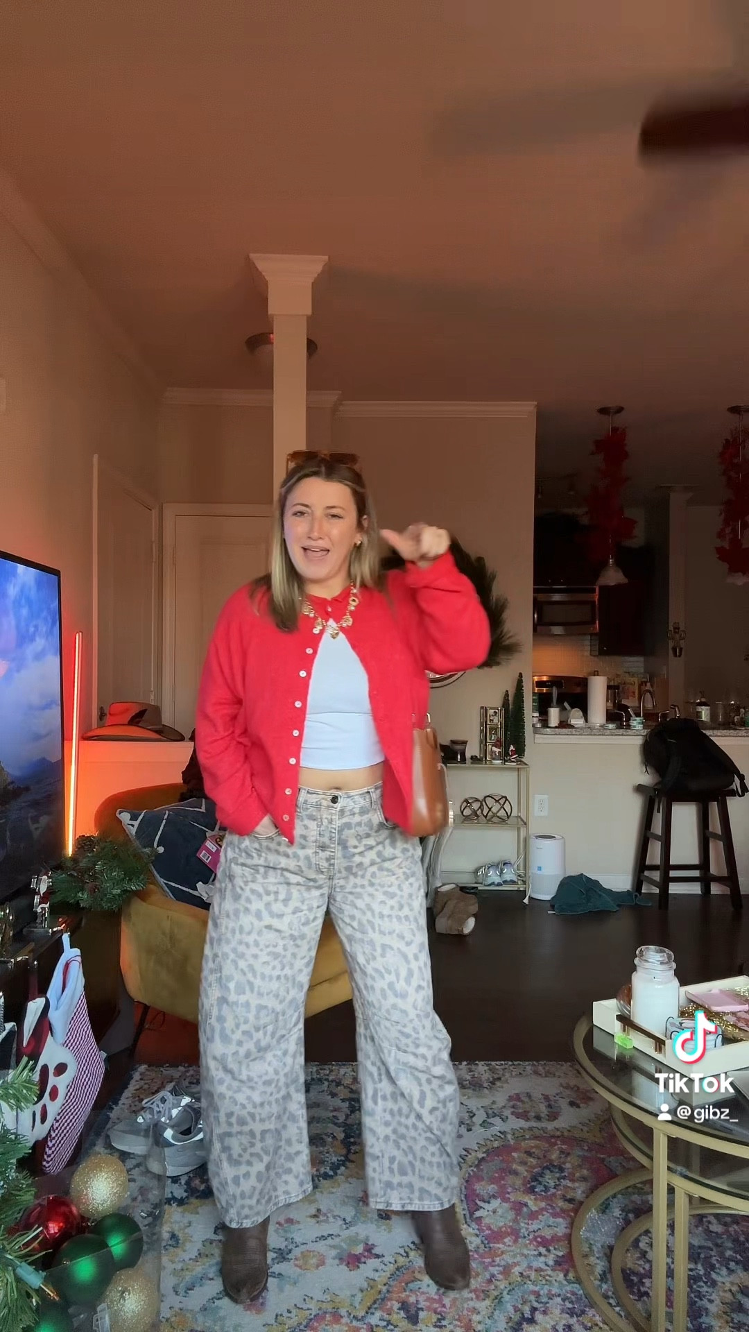 Looking for a cute/ simple holiday outfit?!?! Look no further… the amount of compliments I got on this outfit was insane. I got a size small in the sweater, size small in the top, and size 29 in the jeans!!! 

#LTKStyleTip #LTKSeasonal #LTKHoliday