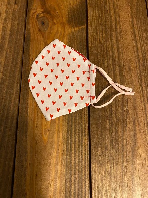Double layer cloth face mask, reusable and washable, adjustable ear loops, white with red hearts,... | Etsy (US)