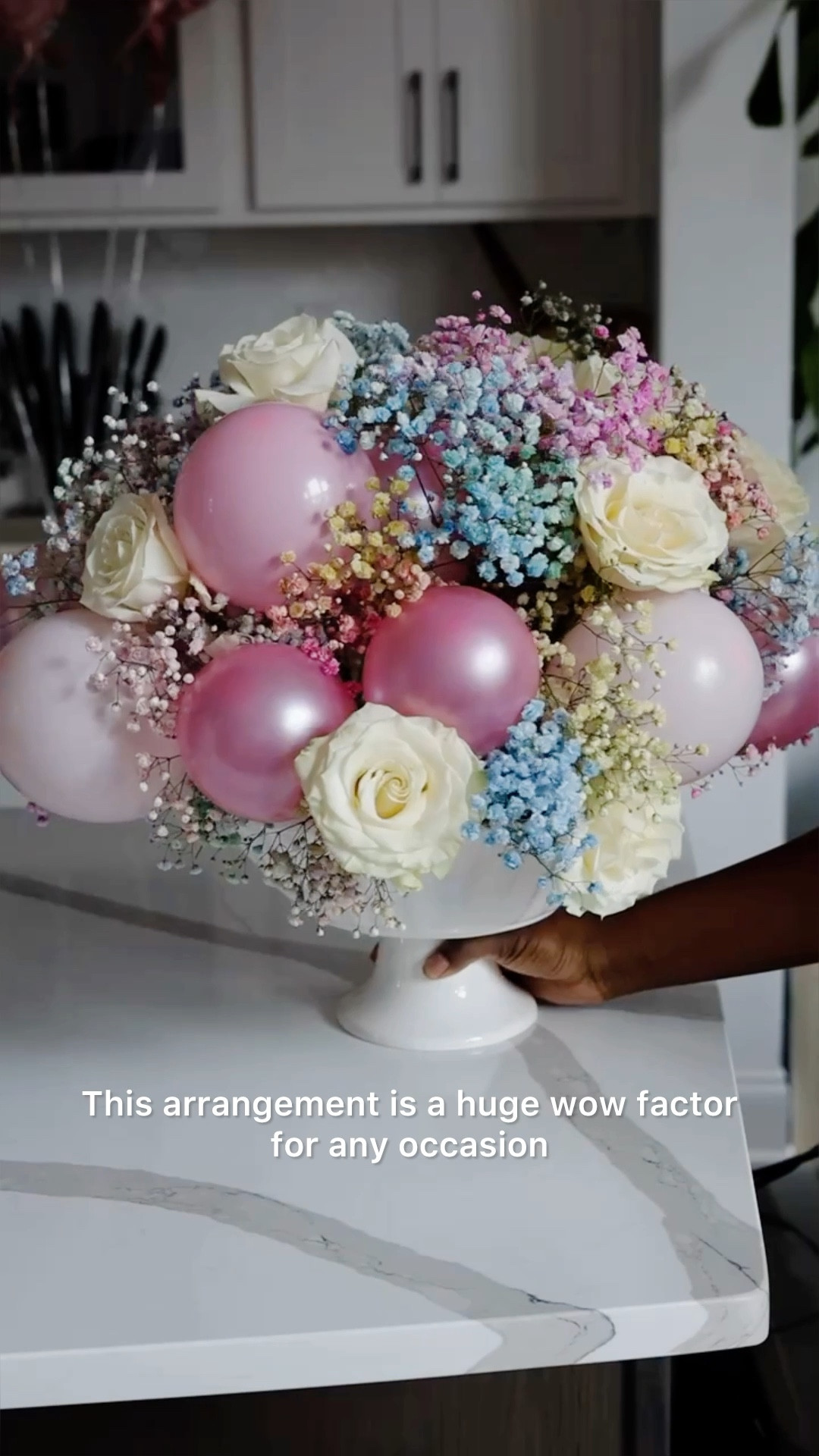 This Balloon Floral arrangement is the perfect addition for any celebration. It brings all the drama and the addition of balloons saves a lot of money on flowers. Here are a few tips:
1. I used 5 inch balloons. I always release a lair for a round shape, but For Easter you can leave the additional air for an egg shape. 
2. The vessel you choose makes a difference. This one is simple but the pedestal on the bottom made it so much prettier in my opinion. I found this one is HomeGoods for $14.99. It’s a serving dish. 
3. Make sure you balance the balloons and flowers when adding them. Distribute them evenly around the base and mix colors evenly as well if you are using more than one. 
4. If you’re using roses make sure you remove the thorns so you don’t pop your balloons. 
5. As always, Have Fun!!


#LTKstyletip #LTKfamily #LTKparties