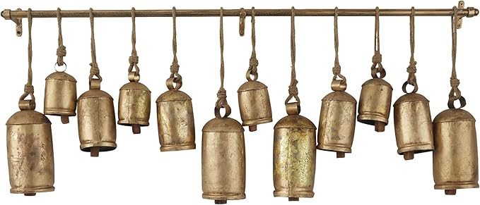 Deco 79 Metal Decorative Cow Bells Tibetan Inspired with 12 Bells on Jute Hanging Ropes and Rod, ... | Amazon (US)