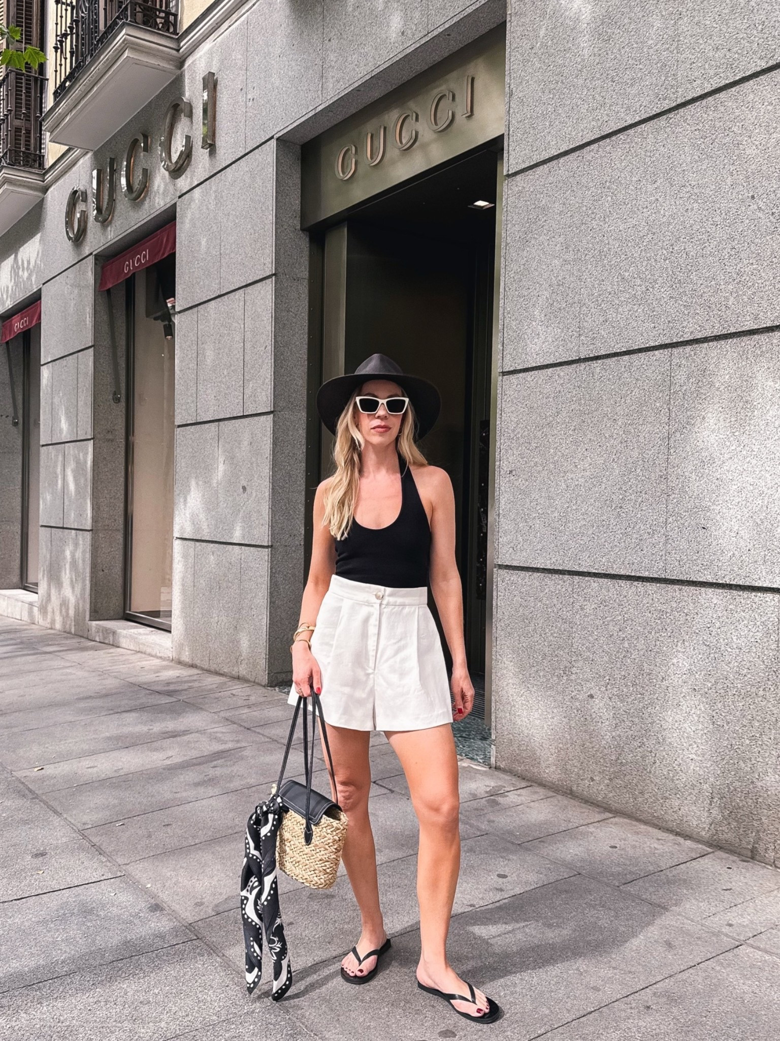 European summer vacation look with black halter top, white linen shorts, leather thong sandals, @Janessa Leone black straw hat

#LTKTravel #LTKOver40 #LTKSaleAlert