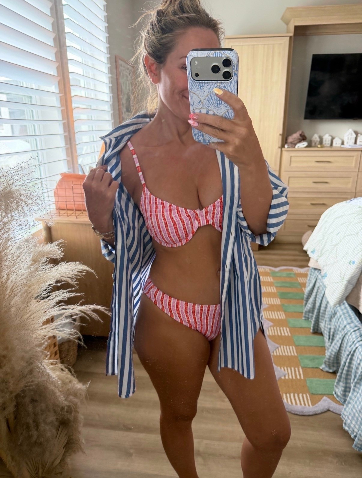 If East Coast summer was an outfit 🇺🇸☀️🌊

The striped button-down, the red-and-white textured swimsuit, the effortless “throw it on and head to the beach” vibe… this is exactly what I want to wear on repeat all season long.

The button-down doubles as the perfect cover-up, and this swimsuit is so flattering and supportive without sacrificing comfort.

Comment LINKS and I’ll send everything your way! ❤️🤍💙