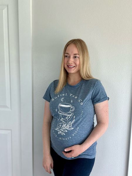 Where are my A Court of Thorns and Roses fans? This Suriel Tea Co T-shirt is perfection 👌🏻. I sized up for a maternity bump friendly fit. Maternity Inset Panel Vintage Slim Jeans. I’m wearing a tinted sunscreen moisturizer, my favorite lip balm, and of course my eyebrows are done. 

#LTKSaleAlert #LTKBump #LTKFindsUnder50
