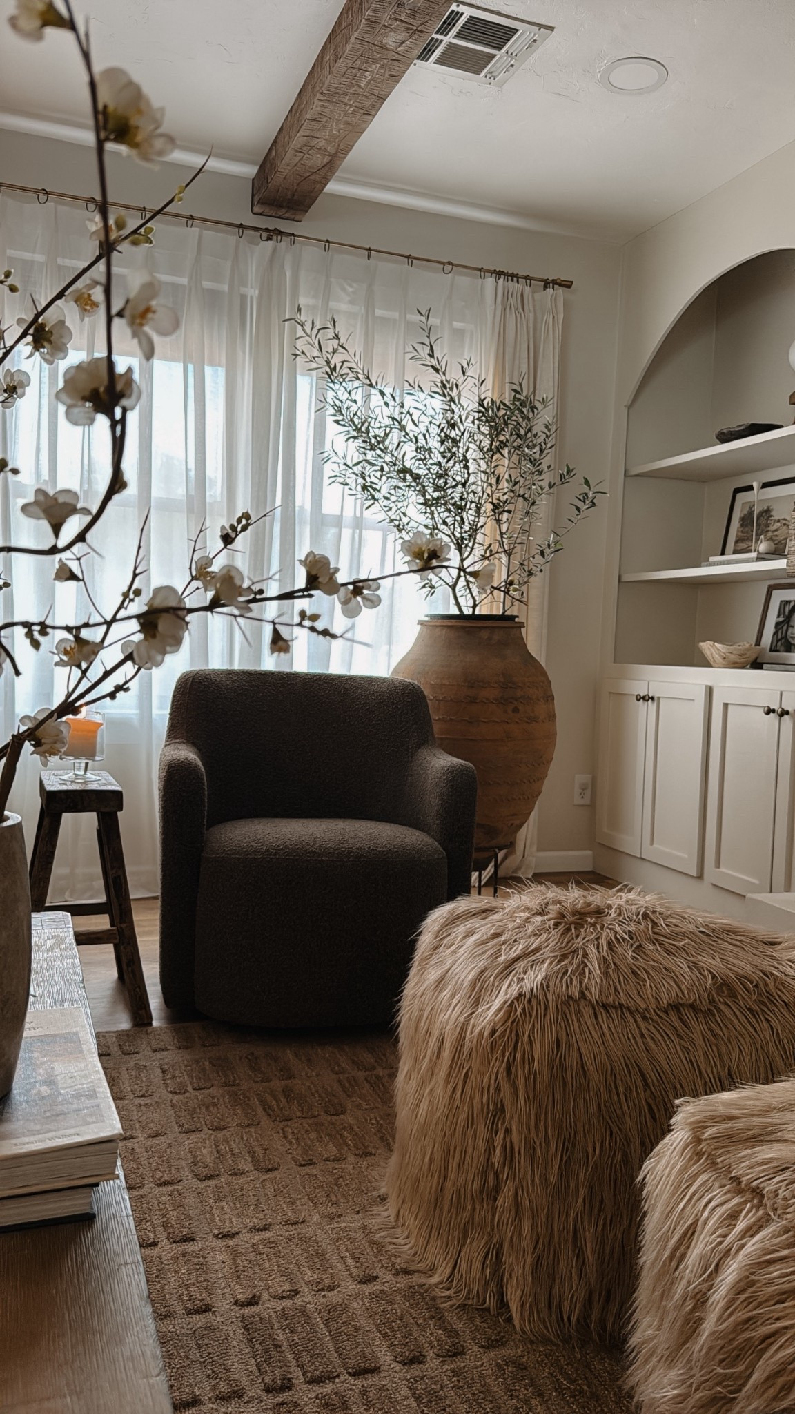 Brown boucle accent chair. I love these affordable cherry blossom stems from Amazon for after the holidays as well! 

#LTKHome #LTKSeasonal