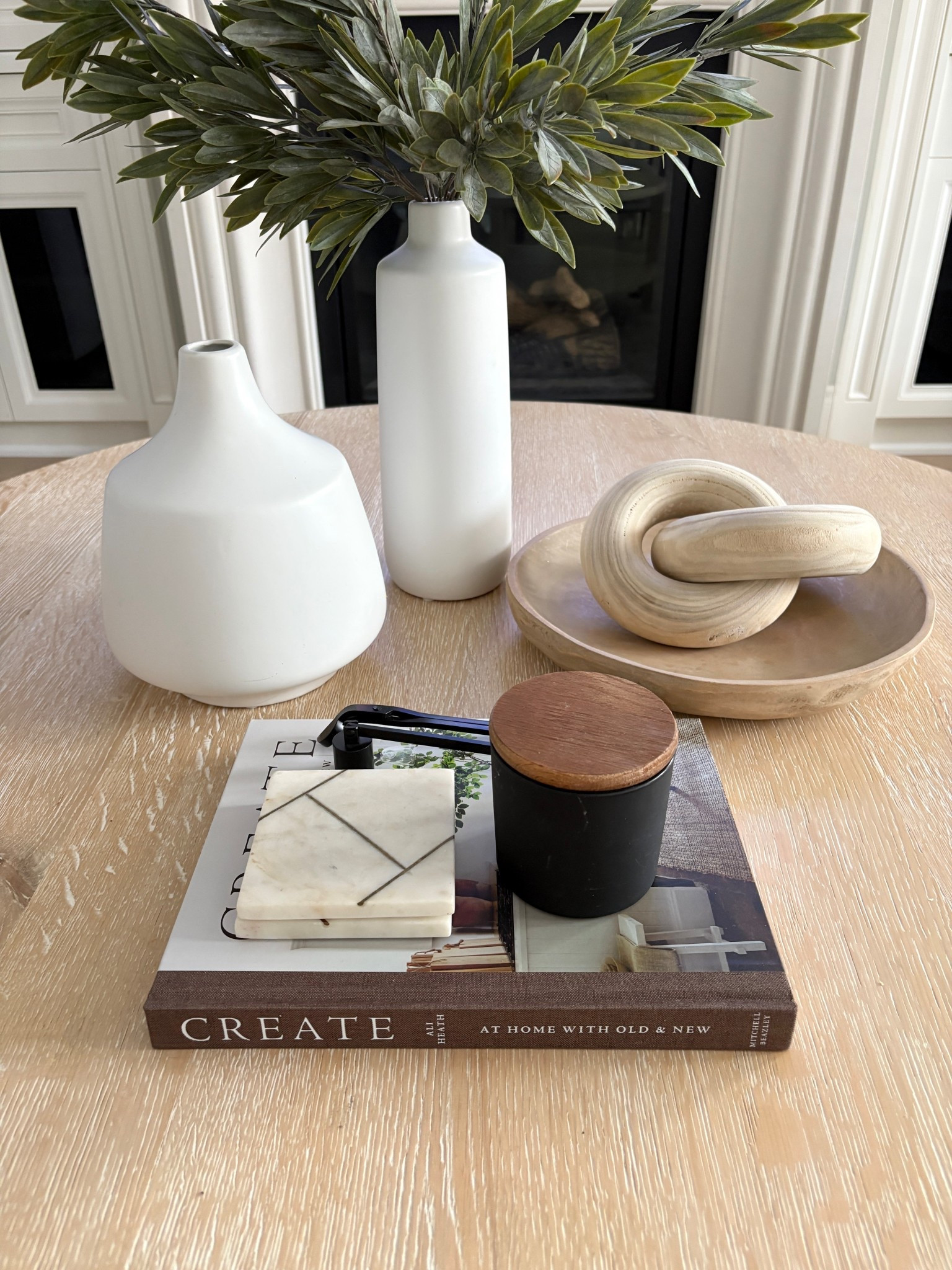 Coffee table styling. 
Vase with faux stems✔️
Functional (coasters,candle)✔️
Decorative book✔️
Also love this round coffee table from @Crate & Barrel 
Interior styling, decor, Amazon, home decor  


#LTKHome