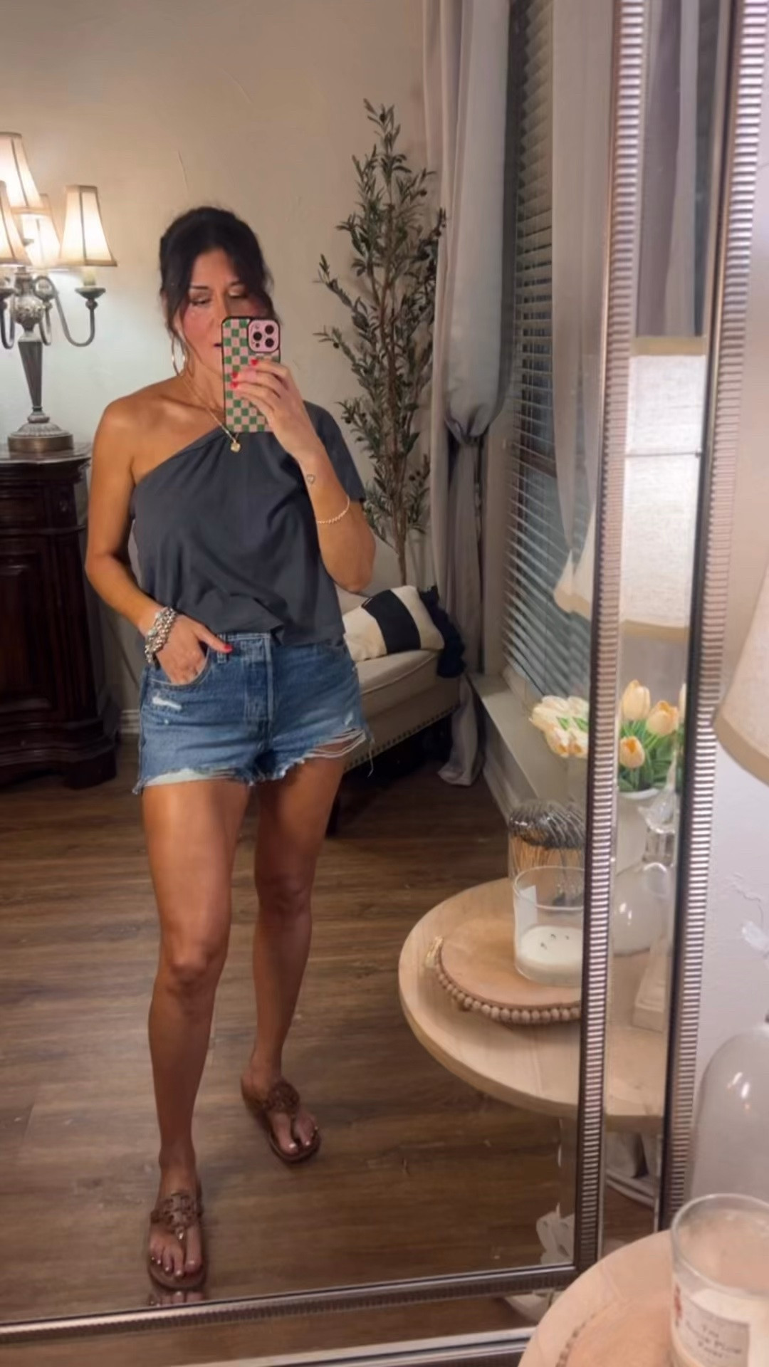 Levi’s shorts and body glow lotion.