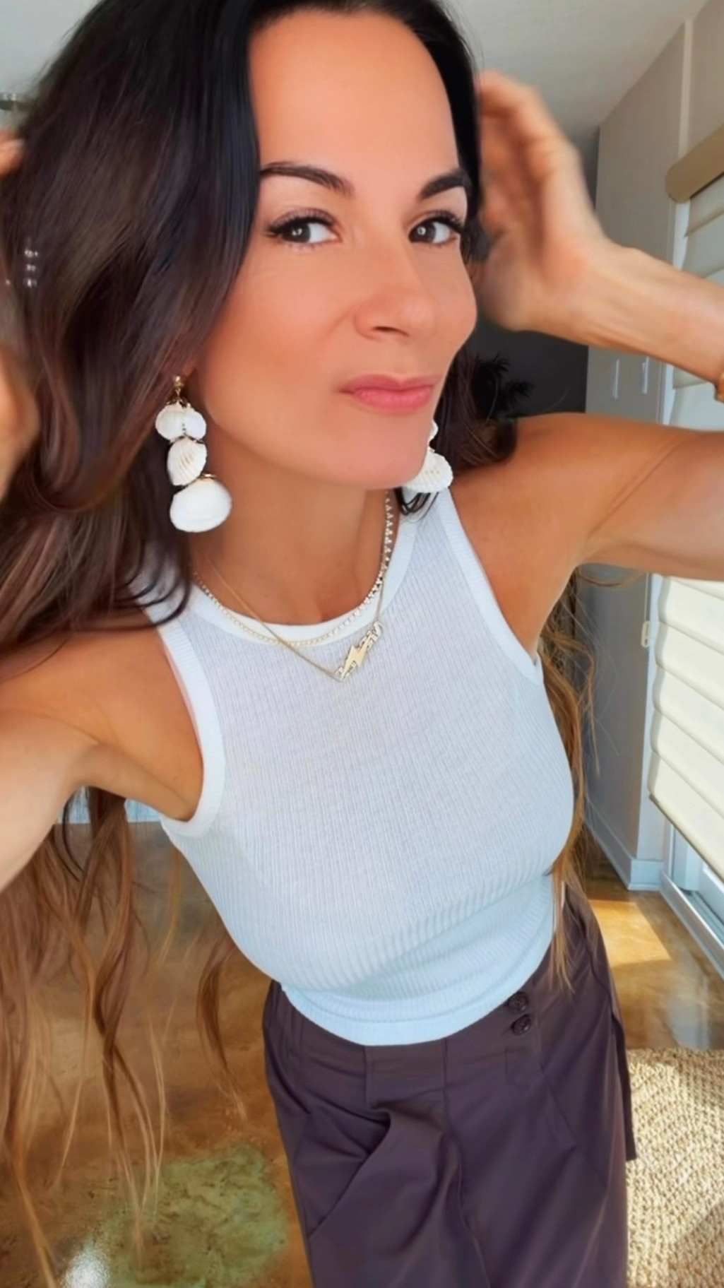 Sometimes the outfit is simple… and that’s exactly why the accessories deserve their moment. 🤍✨

A white tank. Easy draped skirt. Neutral everything.

Then you add a pair of statement earrings… and suddenly the whole look feels intentional.

These shell beauties instantly make even the most basic outfit feel vacation-ready, polished, and just a little more fun. That’s the magic of great accessories—they do all the heavy lifting so your outfit doesn’t have to.

Proof that you don’t need a new wardrobe… sometimes you just need better earrings. 😉🐚

#NicoleColeeStyle #SummerStyle #StatementEarrings #ResortStyle #AccessoryObsessed

#LTKdayinmylife #LTKootd #LTKgrwm