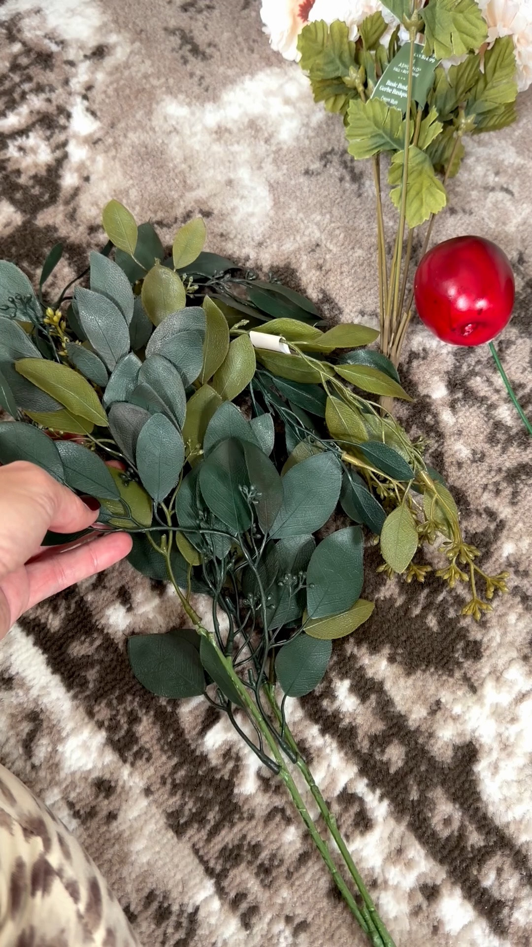 Sunday crafting on the living room floor. I took a couple of the faux seeded eucalyptus stems I bought last week, weaved them onto a small grapevine wreath, and then hof glued on a few apples. So easy to make but super cute for fall!

#LTKHome #LTKSeasonal #LTKdayinmylife