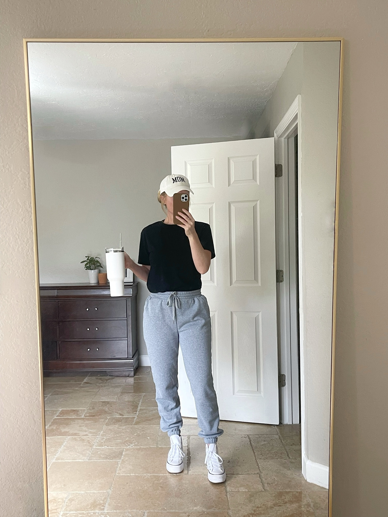 Comfy errands outfit: baseball hat, black tee, grey sweatpants, high top sneakers, Stanley cup 

#LTKActive #LTKSaleAlert #LTKStyleTip