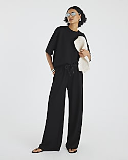 Black Premium High Waisted Wide Leg Joggers | River Island UK & IE