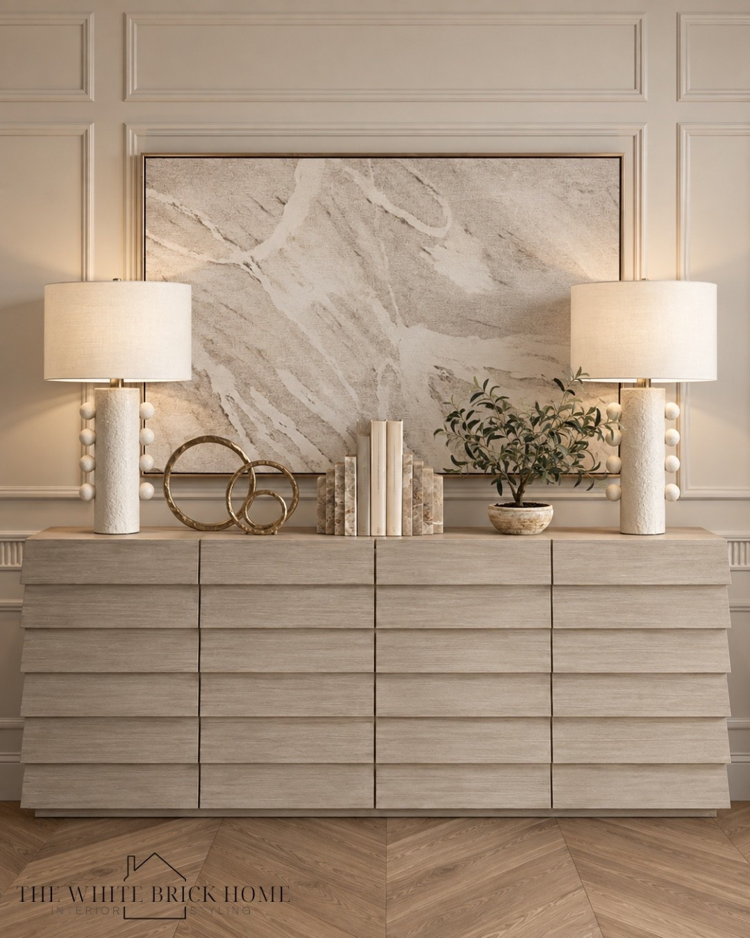 Warm neutrals, sculptural details, and natural textures come together for an effortlessly elevated statement. 

Sideboard, sideboard styling, wall art, table lamp, lamps, home decor, home accessories, home accents