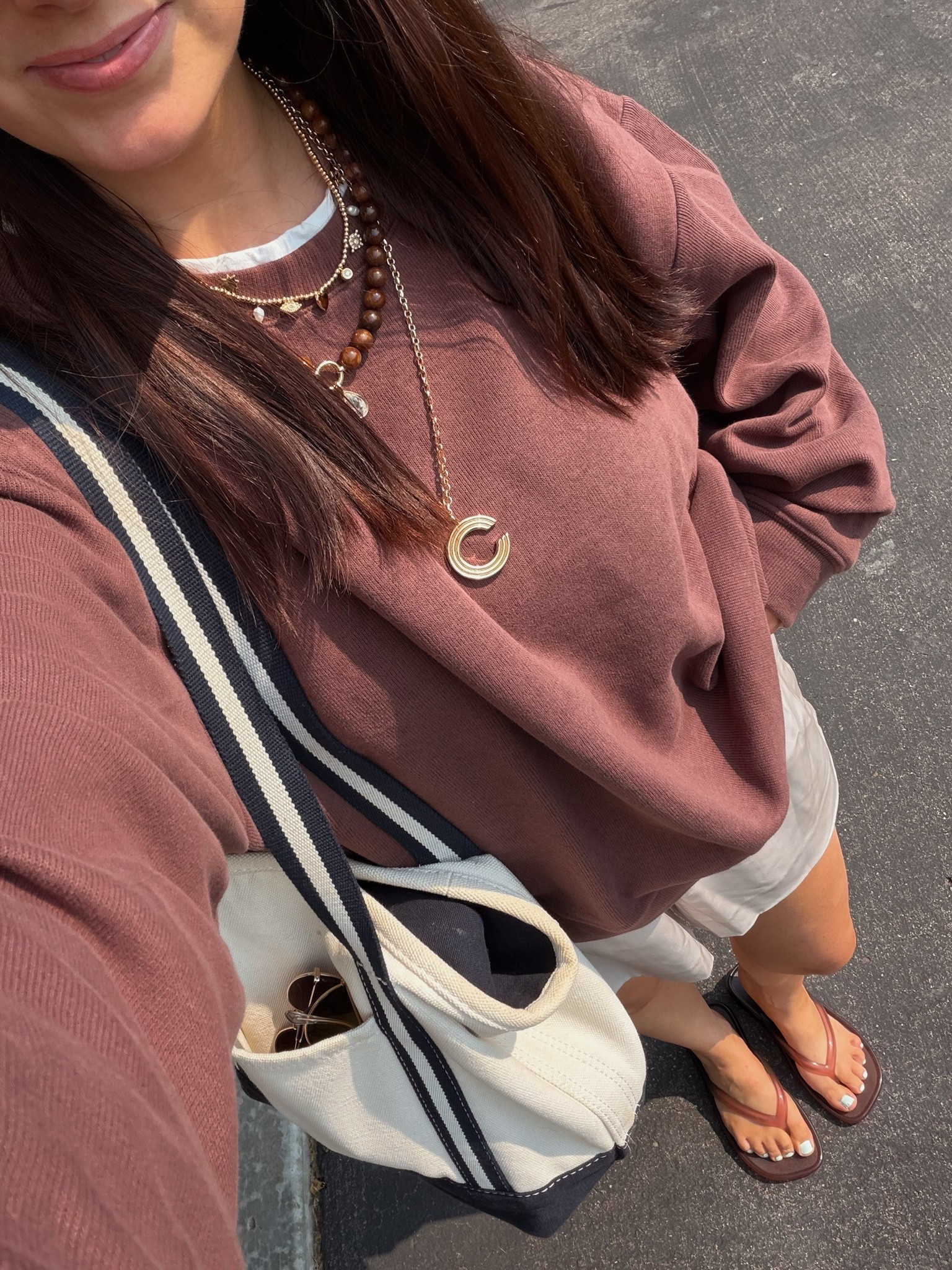 Loveee this layered sweatshirt with sewn in tee!! Wearing s in chocolate - under $80 & lots of colors! Oversized fit. S in these satin shorts as well! Elevated loungewear that has pockets. Jelly flip flops tts. Tote bag on sale! I have the medium size with long straps

#LTKPetite #LTKSaleAlert #LTKSeasonal