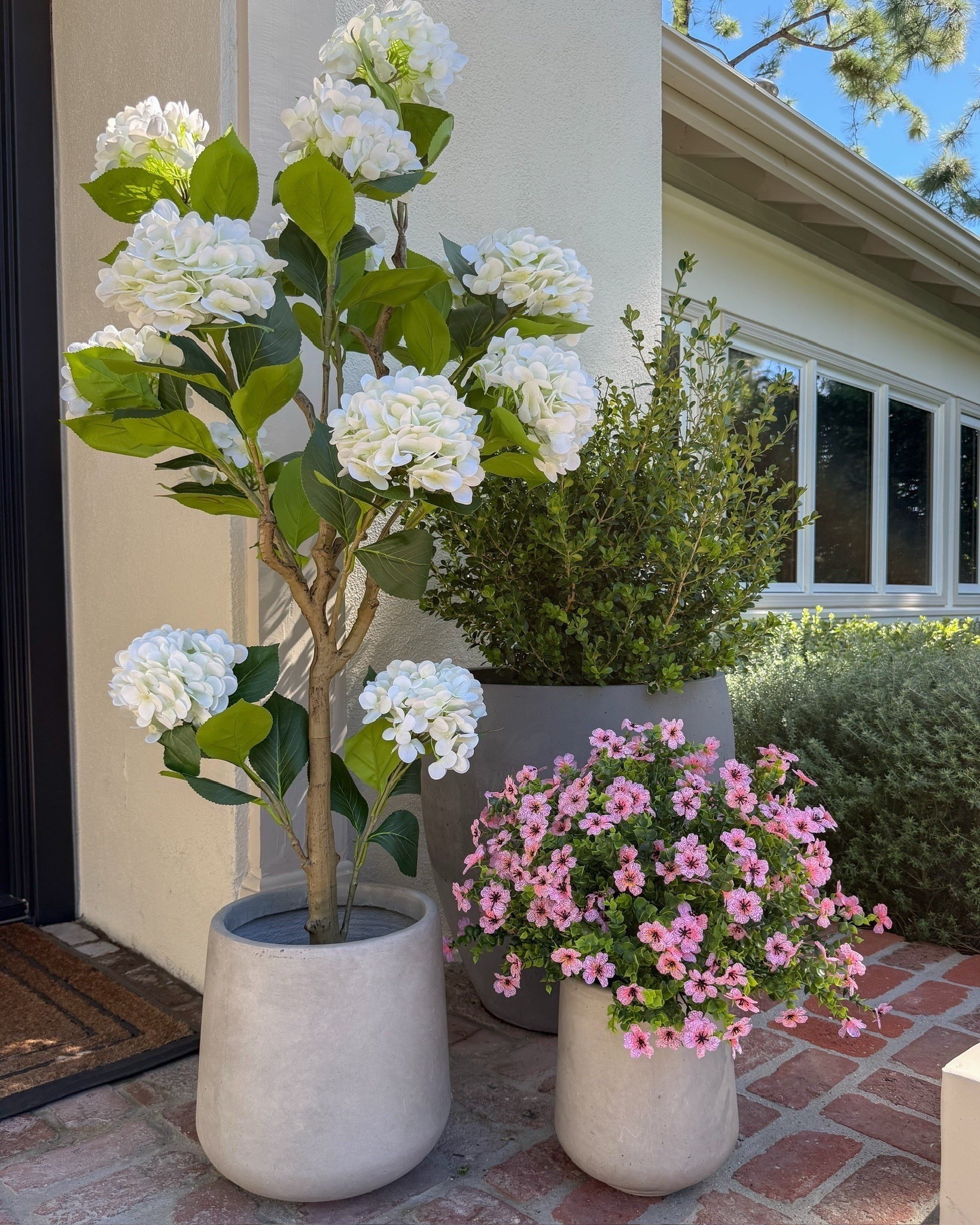 Absolutely gorgeous faux hydrangea and potted flowering plants that will last you all spring and summer long - zero maintenance! I was not expecting these to be as good as they are! Planters are part of the set linked.

#LTKHome #LTKSeasonal #LTKvlog