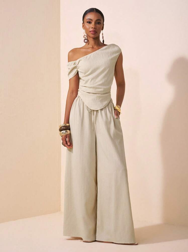 Zivah 2pcs/Set 2025 Spring & Summer New Collection Music Festival, Easter, St.Patrick's Day, Western Style, Nomadic Style, Birthday Party, Graduation Season, Collegiate Style, Student Wear, Casual Everyday, Basic Versatile, Leisure, Vacation, Cruise Travel, Beach, Sunbathing, Viral , Streetwear, Wedding Guest Boho Style, Commuting Style, Brunch Outfit, Airport Outfit - Beige Asymmetrical Shoulder Design Ruched Hem Cropped Top And Textured Fabric Two Pieces Set One Shoulder Top Wide Leg Pants Set | SHEIN