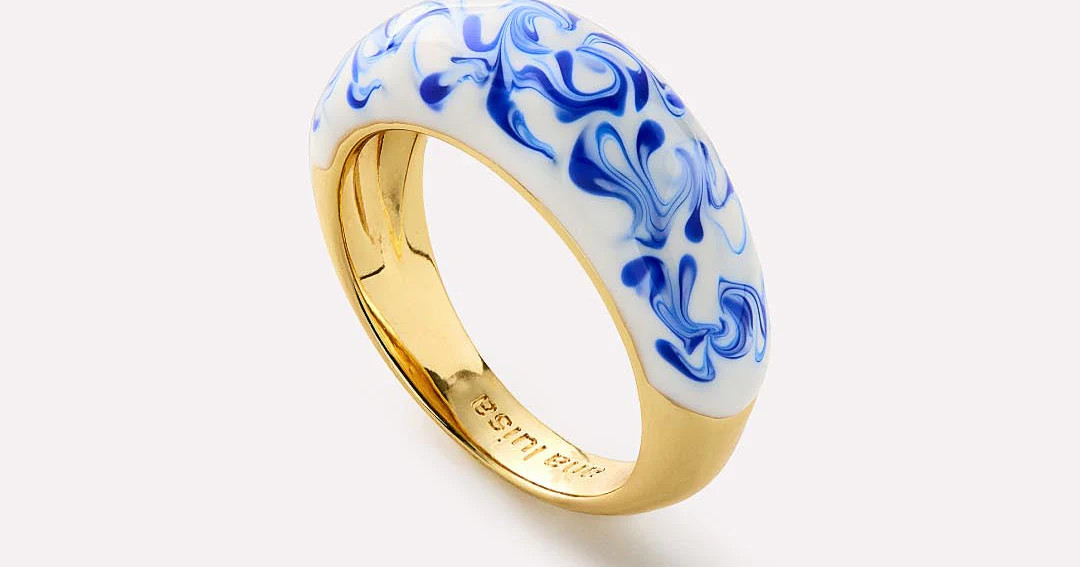 Eye-catching and unique, this enamel ring plated in 14k gold features a handcrafted marble blue d... | Ana Luisa