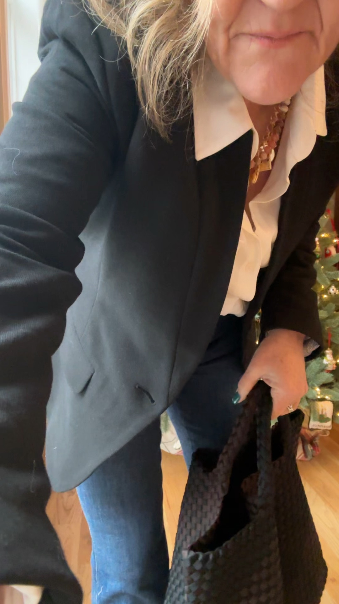 This is the notch collar blazer that is also 30% off through January 1 with my code NANETTE30 

It’s a lined knit blazer that’s very comfortable, but has enough substance to it to look professional if needed. 

Size up if in between. 
The blouse is on sale too. It is a utility shirt that has a relaxed vibe. I am wearing my larger size. 

My jeans are ALL THAT!!!! I am wearing a medium petite.  They require the spanks shimmy, because they are pull on. They have really good compression and you just feel amazing in them. They are meant to wear with heels. 20% off spanx with code NANETTEXSPANX 

I love my new bag. It’s quite practical is washable and it just has a lot of style. 

Naghedi tote bag splurge worthy bag spanx jeans black blazer 