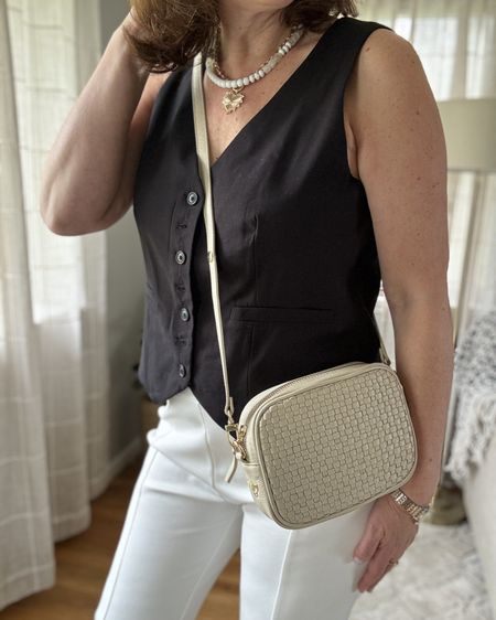 Chic black and white separates 

The white pants have a cute slit on the front of each pant leg. Slide to see video   Code Theresa15 at Jude Connally 

Handbag at Apatchy London - code Theresa10 for 10% off

Layering jewelry use code BF20 for 20% off


#LTKstyletip #LTKparties #LTKmidsize