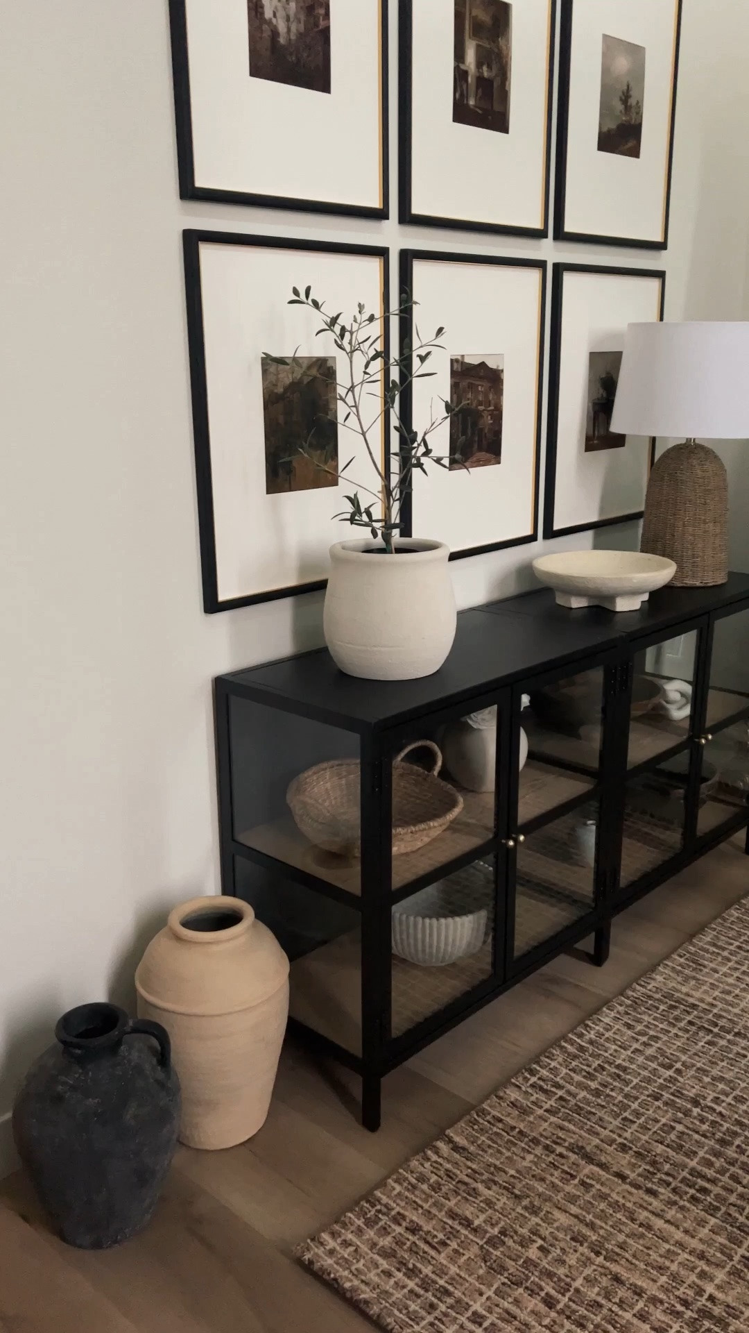 These glass cabinets are on sale! We had these in the entryway of our previous home. I just flipped the back faux wood panel around to reveal a black panel. These are great quality and would work great under a TV too. ￼

#LTKHome #LTKSaleAlert