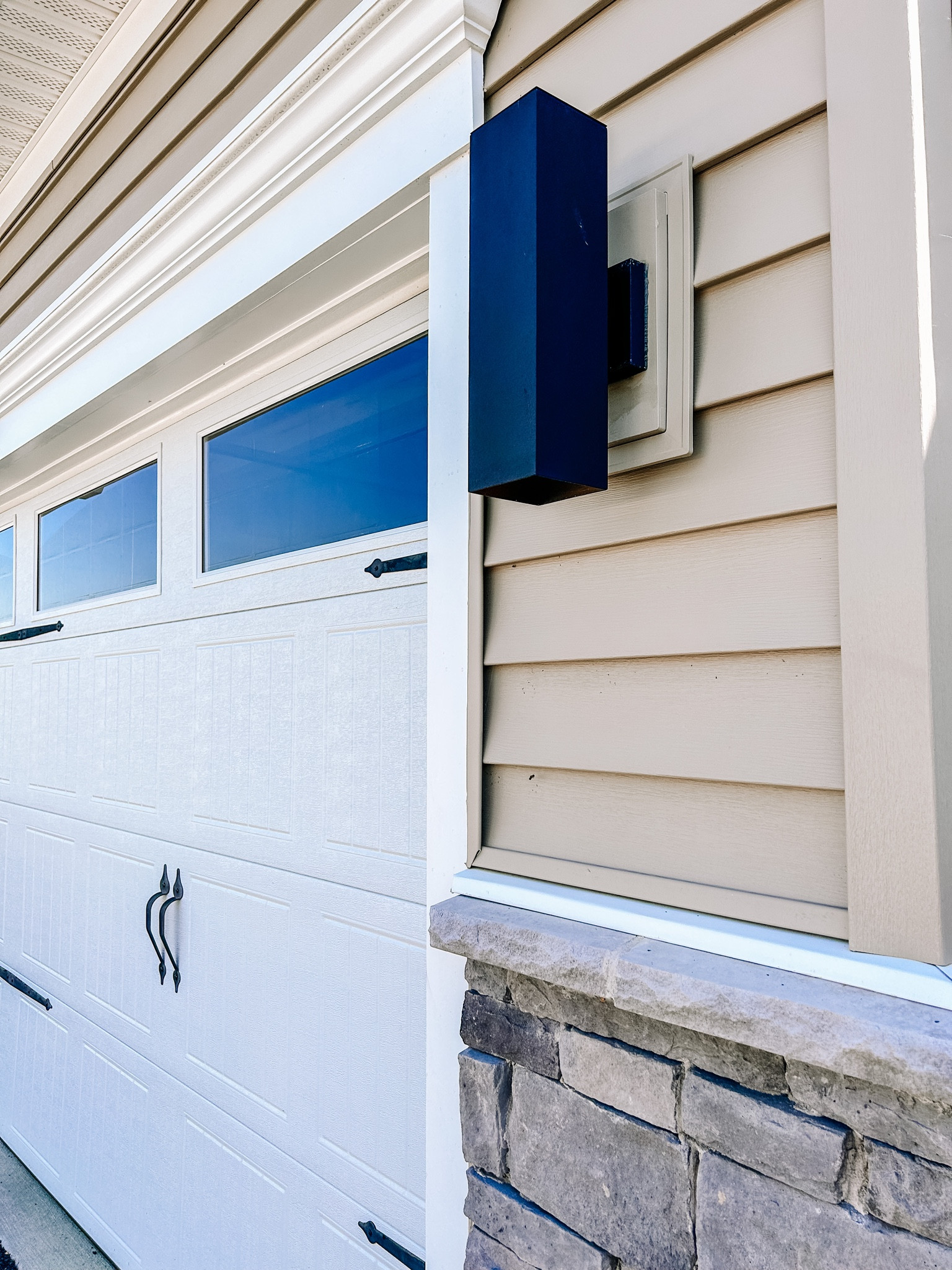 New exterior light for the win at an incredible cost.  Linking a similar option since mine is sold out. 🤍

#home #lightfixture #exteriorlight #garagedoor 

#LTKunder50 #LTKFind #LTKhome