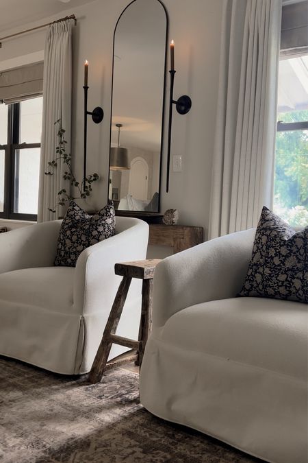 Cozy organic modern neutral living room. Slipcovered swivel accent chairs  

#LTKhome