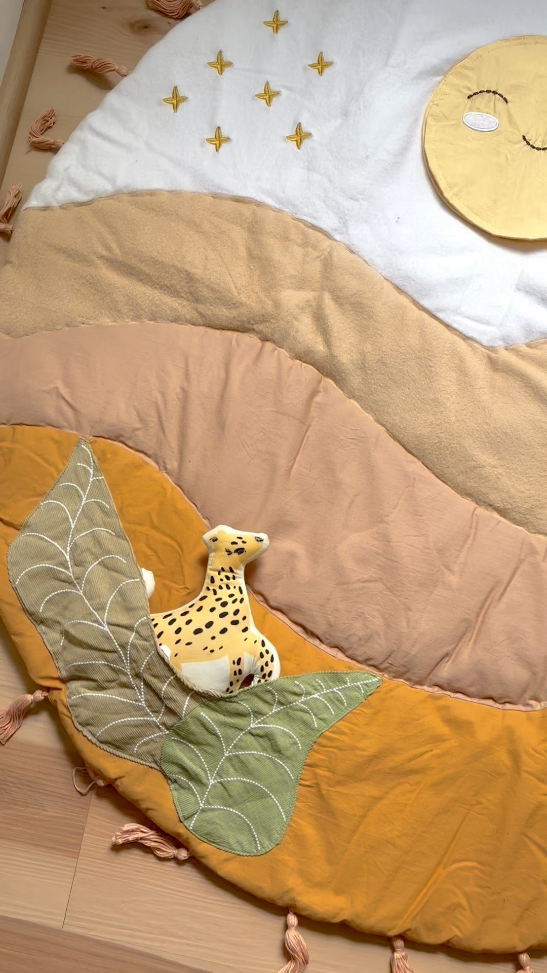 The Kendi Activity Playmat is a beautifully quilted mat had playful textures, and soft support to your baby's daily play! This mat features several interactive elements designed to encourage your baby’s natural development, including a “sun” mirror that crinkles, a “leopard” plush toy that rattles, and a “bird” plush toy that chirps when squeezed. 
🌞🕊️🐆💛

#ad #gifted #CraneBaby  #CraneBabyPartner #shopltk #liketkit #ltkbaby 

#LTKFamily #LTKFindsUnder100 #LTKBaby