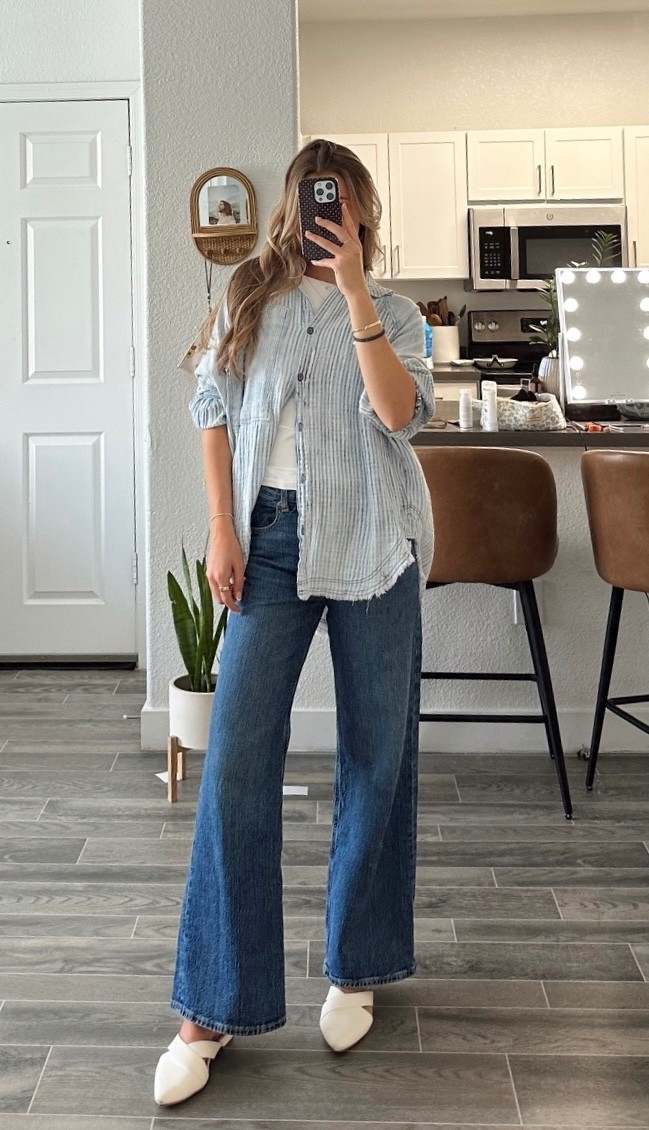 blue strip shirt is size XS, white top underneath is a size S and jeans are size 2! i’m 5’6 for reference:)