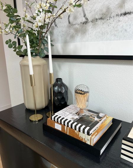 Entryway console table // 
Coffee table books, match cloche, faux greenery, vase, amazon home, candle holder, gold candle holder 

#LTKhome #LTKstyletip