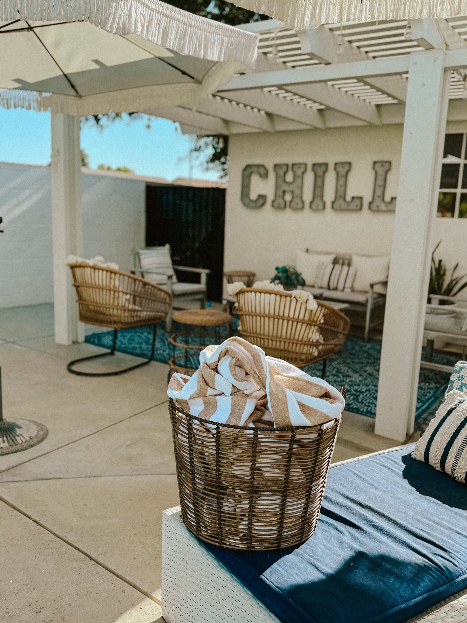 Not a great pic of these pool towels but when I shared the towels I had some messages about this basket! It’s from Walmart! 

Also linked our fringe umbrellas too!!