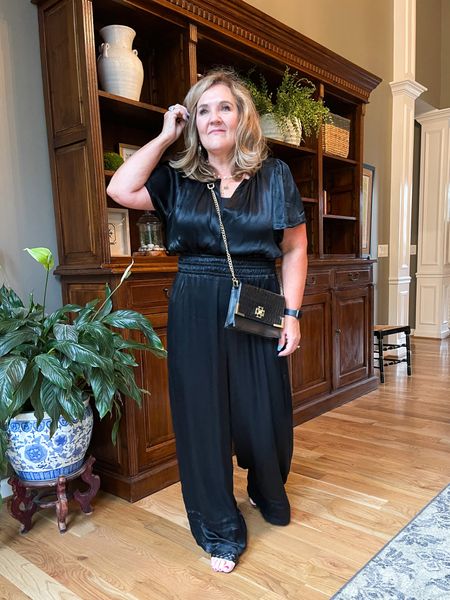 The Somerset Jumpsuit in lightweight satin. I’m in an XL petite and it is long. Still love it but def didn’t need to size up. Order your true size  

#LTKcurves #LTKwedding #LTKHoliday